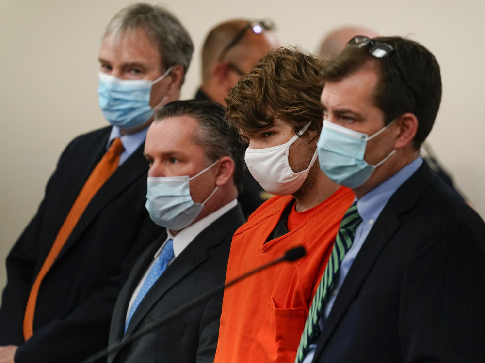 Payton Gendron (second from right), the gunman charged in the deadly mass shooting in May at a Tops supermarket in Buffalo, N.Y., appears at a court hearing on May 19.