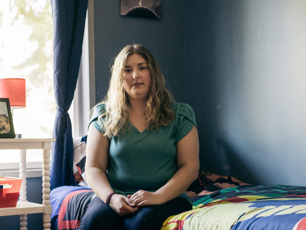 Katie-Jo Page sits in a room she has prepared for Mykyta, a Ukrainian boy her family was in the process of adopting, in Snohomish, Wash., on Oct 2.