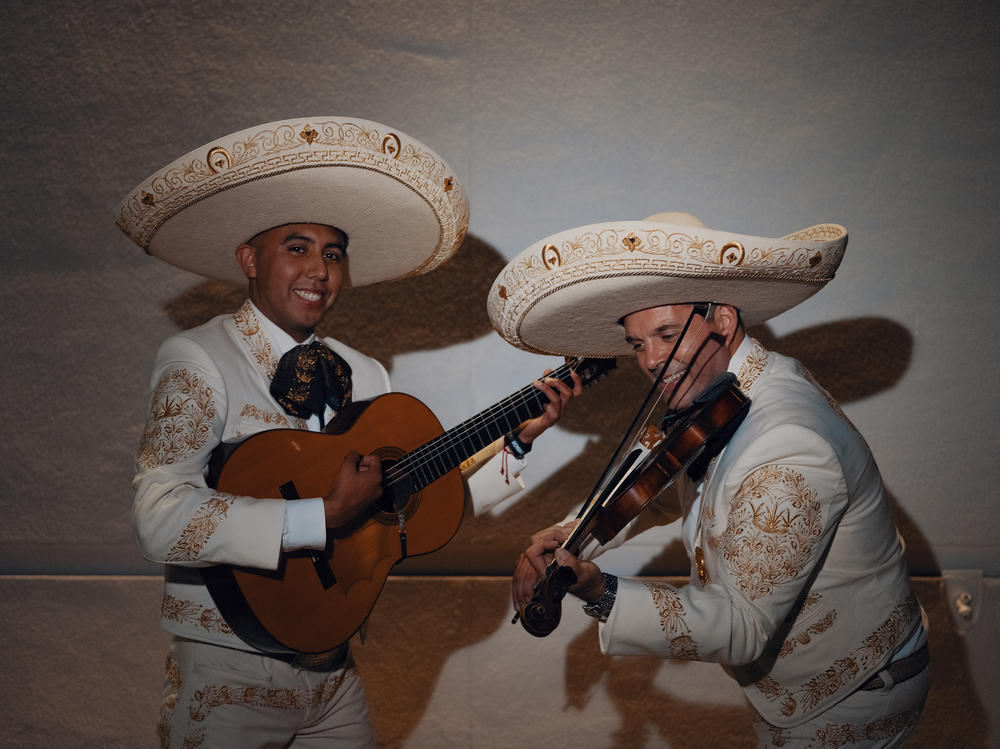Two performers from Mariachi Los Reyes pose for a photo at the MARIACHI USA festival in June.