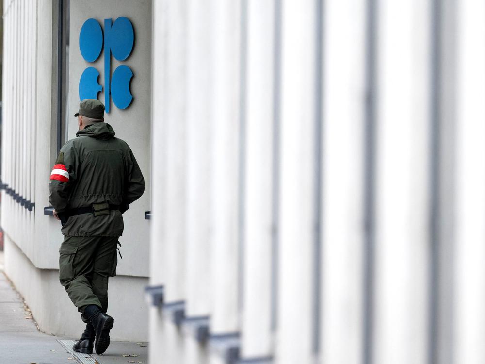 An Austrian soldier guards the entrance of the OPEC headquarters in Vienna on October 4, on the eve of the 45th Meeting of the Joint Ministerial Monitoring Committee and the 33rd OPEC and non-OPEC Ministerial Meeting. OPEC and its allies agreed to reduce their production quotas at that meeting.