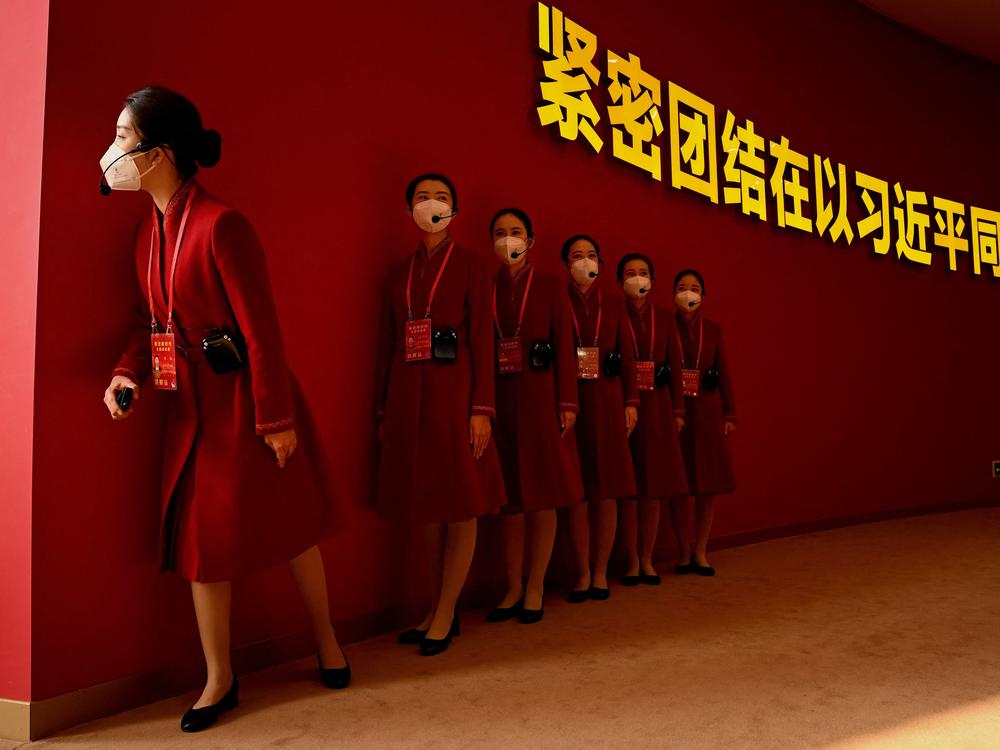 Attendants wait to guide visitors to the the exhibition entitled 