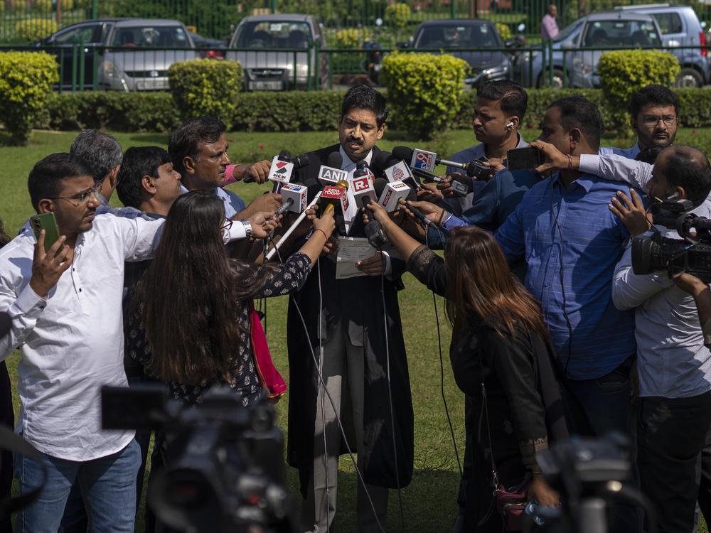 Aftab Ali Khan, a lawyer representing one of the petitioners briefs media persons at the Supreme Court premises in New Delhi, India, Thursday, Oct. 13, 2022.