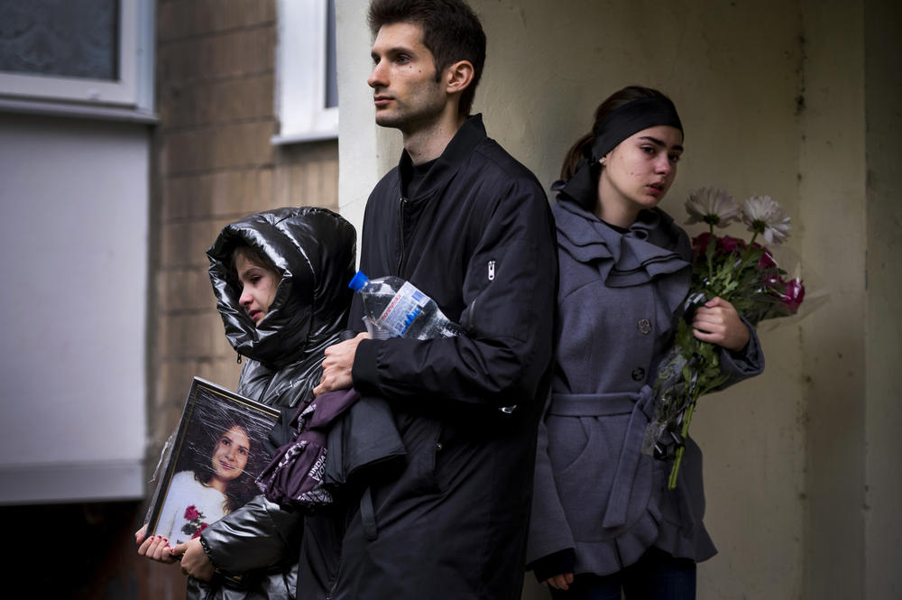 Mourners at the funeral of 11-year-old Anastasiya Grycenko in Karhkiv on Sept. 20.