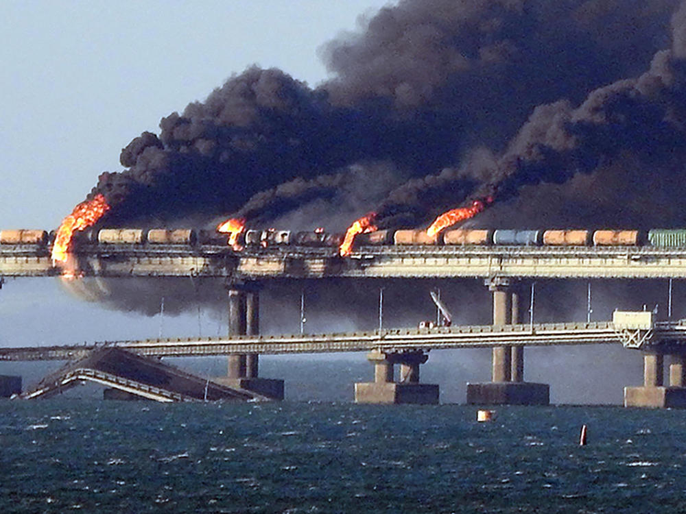 Black smoke billows from a fire on the Kerch bridge that links Crimea to Russia after an explosion on Saturday.