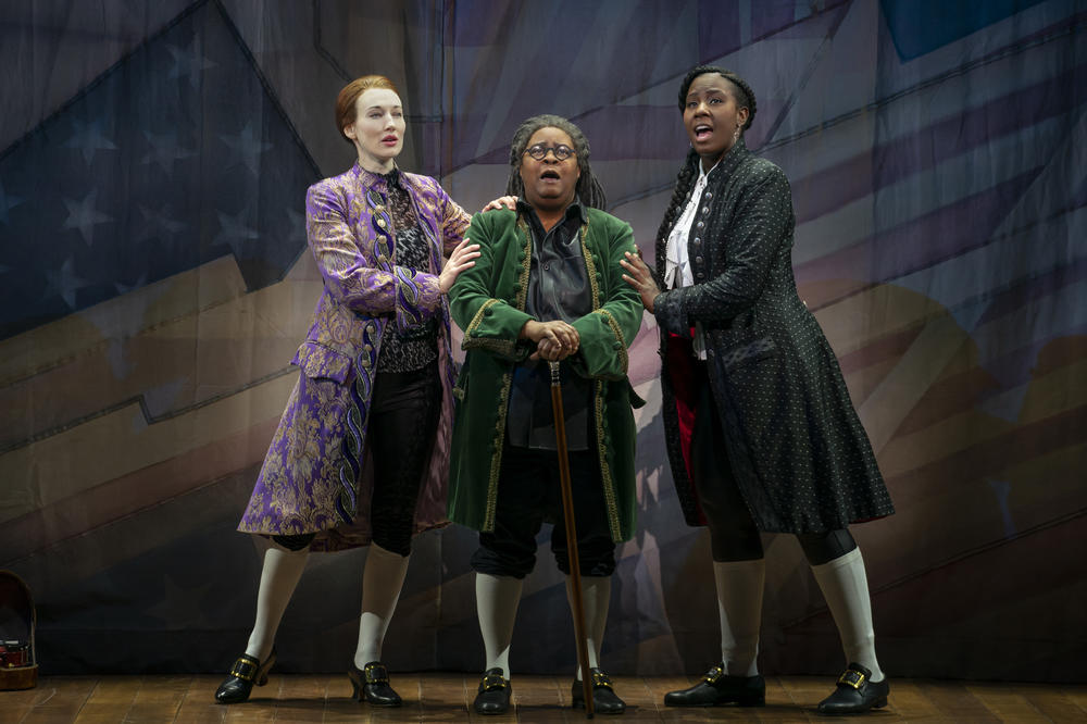 Elizabeth A. Davis as Thomas Jefferson, Patrena Murray as Benjamin Franklin and Crystal Lucas-Perry as John Adams in <em>1776</em>.