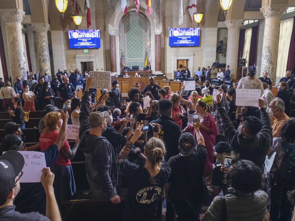 People protest before the cancellation of the Los Angeles City Council meeting on Wednesday.