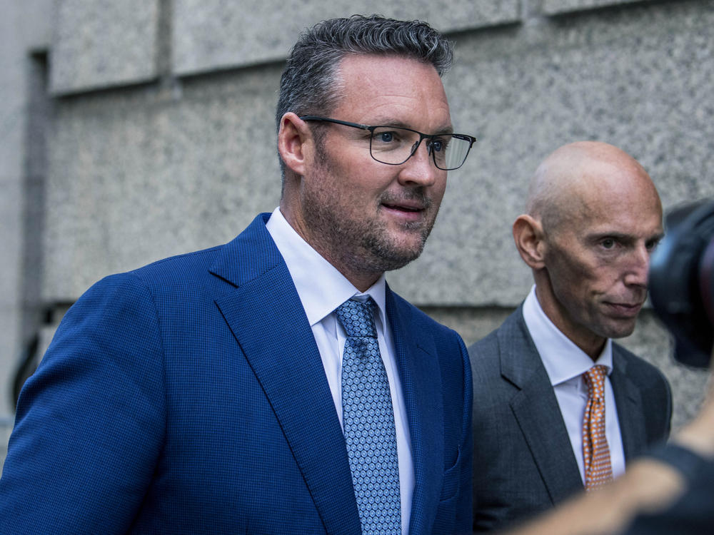 Trevor Milton (left) leaves the Thurgood Marshall United States Courthouse in New York on Sept. 12. Milton was convicted Friday of deceiving investors with exaggerated claims about his company's progress in producing zero-emission trucks.
