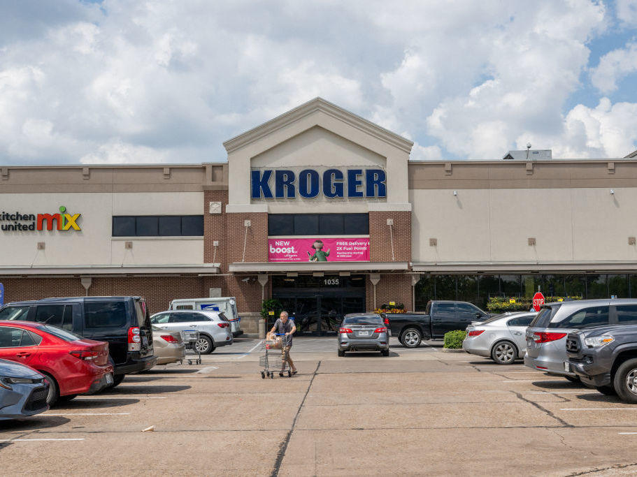 A customer exits a Kroger grocery store on Sept. 9 in Houston, Tx.