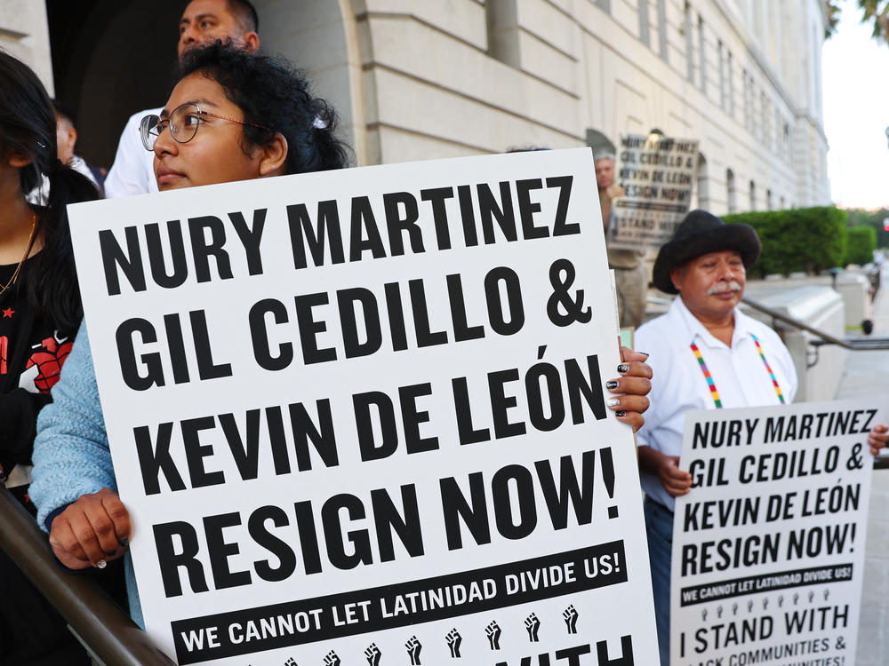 Protesters outside City Hall call for the resignations of LA City Council members Kevin de Leon and Gil Cedillo on Wednesday.