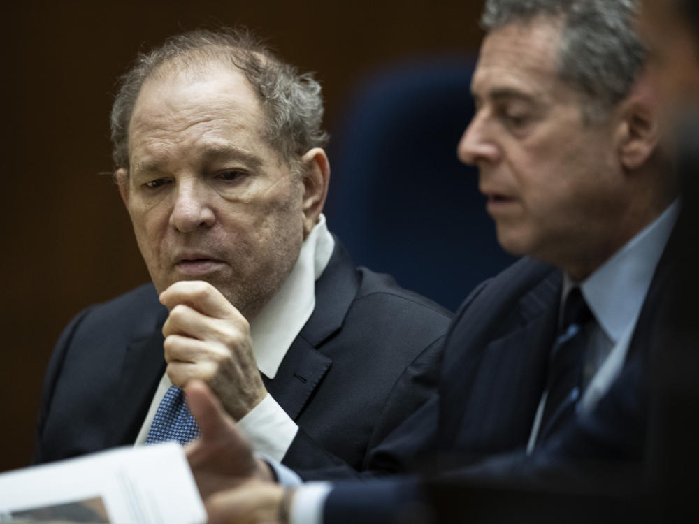 Former film producer Harvey Weinstein, left, interacts with his attorney Mark Werksman in court at the Clara Shortridge Foltz Criminal Justice Center in Los Angeles, Calif., on Oct. 4 2022.