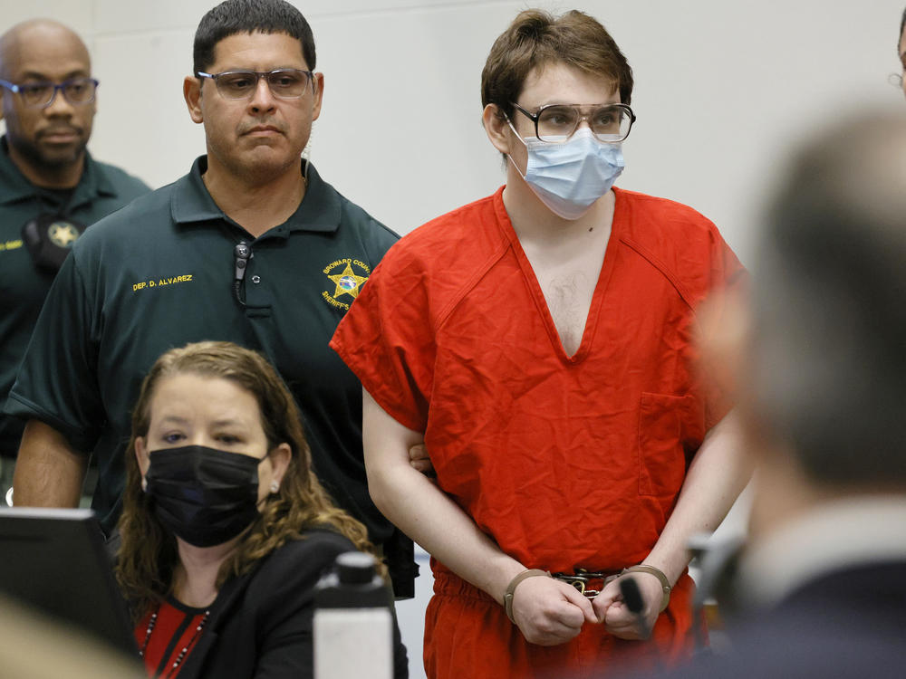 Marjory Stoneman Douglas High School shooter Nikolas Cruz is escorted into the courtroom for a hearing regarding possible jury misconduct during deliberations in the penalty phase of his trial on Oct. 14, 2022, in Fort Lauderdale, Fla.