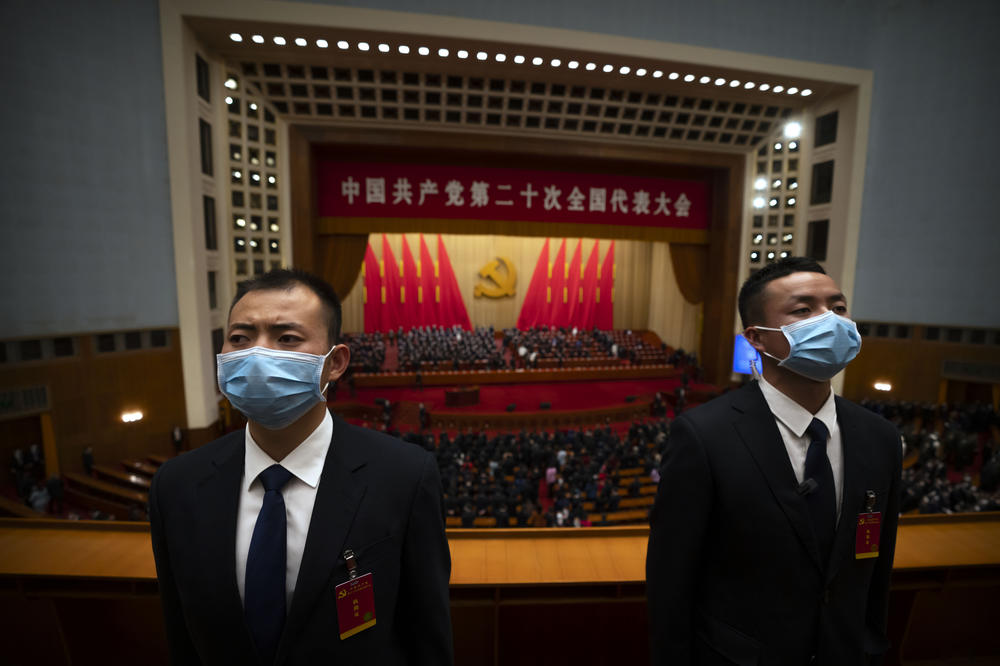 Security officers wearing face masks stand guard after the opening ceremony of the 20th National Congress of China's ruling Communist Party at the Great Hall of the People in Beijing.