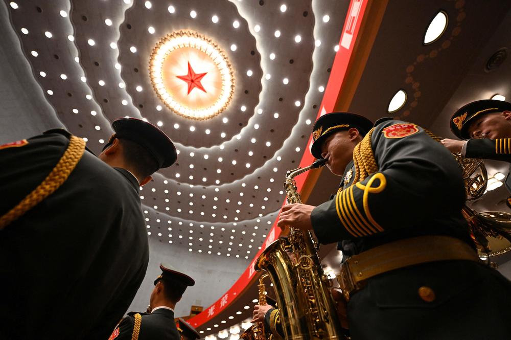 The People's Liberation Army (PLA) band performs during the opening session.