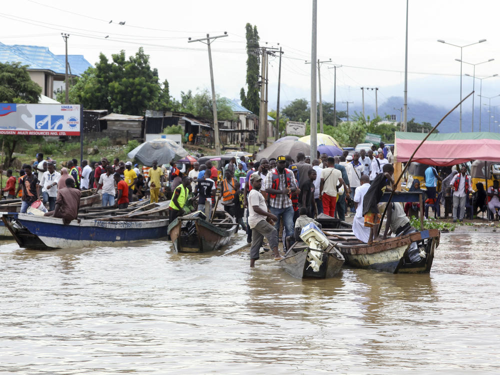 People stranded due to floods following several days of downpours In Kogi, Nigeria, on Oct. 6.