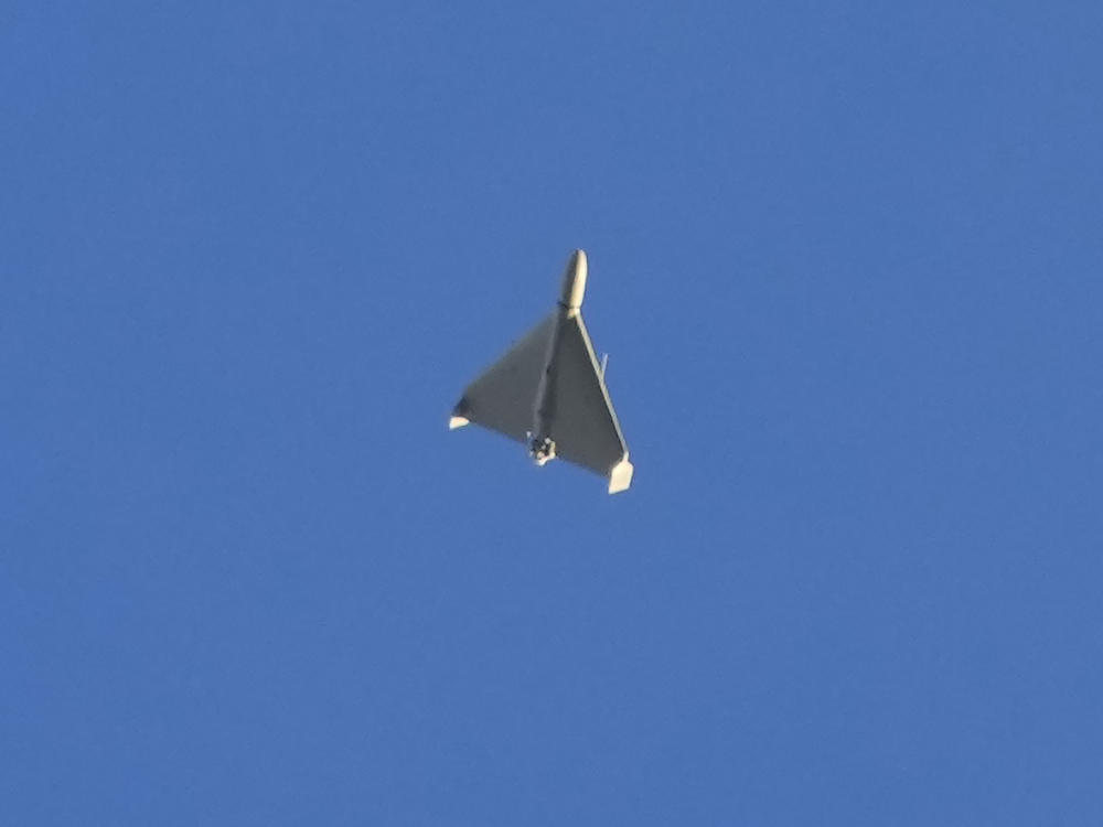 A drone is seen in the sky seconds before it fired on buildings in Kyiv, Ukraine, Monday, Oct. 17, 2022.