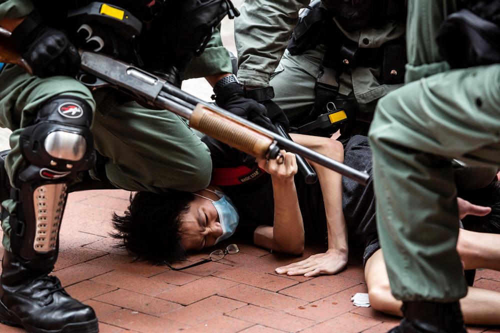 Pro-democracy protesters are arrested by police in the Causeway Bay district of Hong Kong on May 24, 2020, ahead of planned protests against proposed security legislation in Hong Kong.