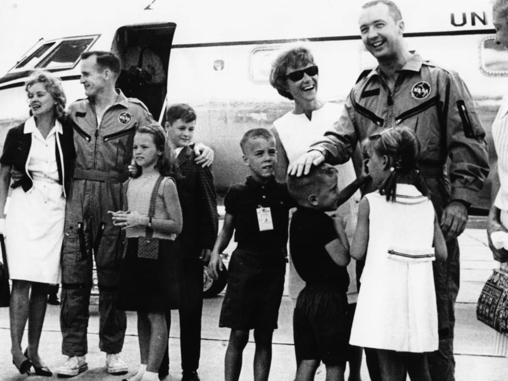 American astronauts Jim McDivitt (right) and Edward White greeting their families after returning home safely from their Gemini 4 space flight in June 1965.