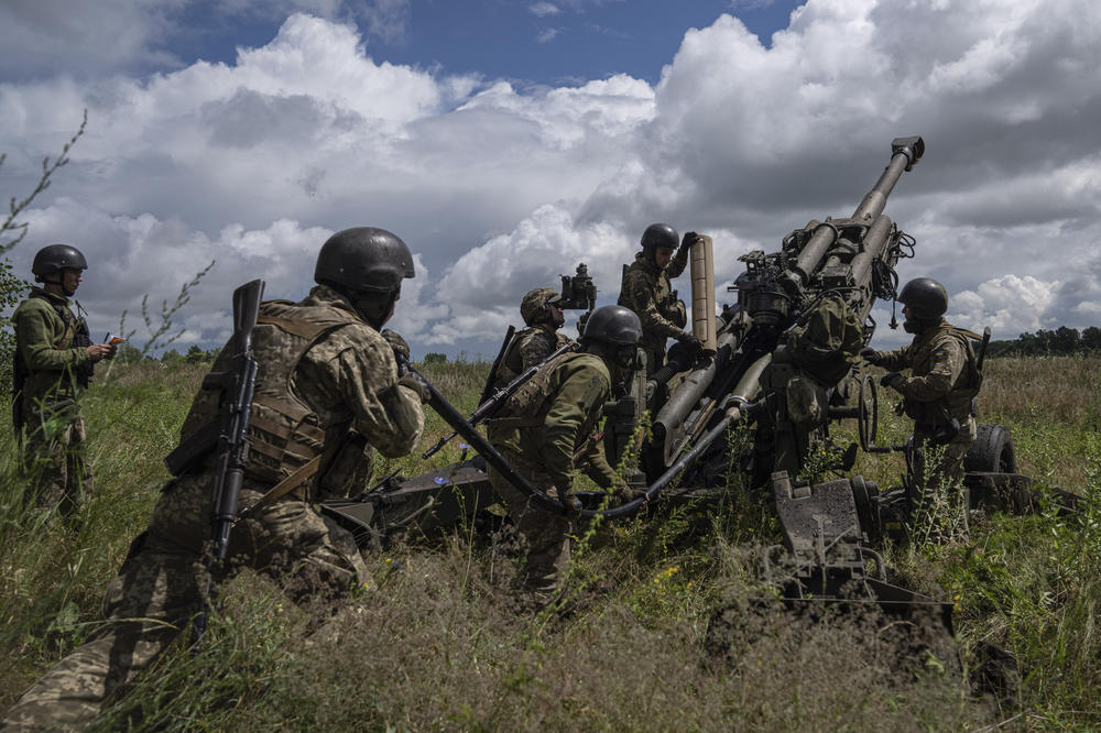 Ukrainian servicemen prepare to fire at Russian positions from a U.S.-supplied M777 howitzer in the Kharkiv region on July 14.