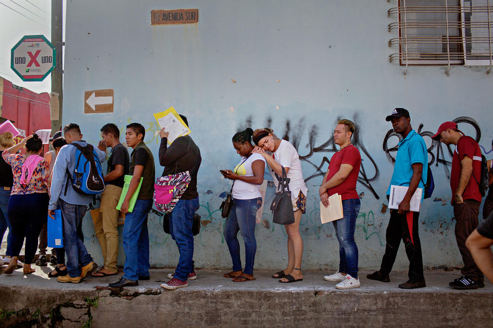 Kataleya Nativi Baca, a transgender woman from Honduras, waits in line to enter the Mexican Commission for Refugee Aid in Tapachula on Sept. 3, 2019, the day before leaving for Tijuana on the U.S./Mexico border. Baca says she did not feel safe in Tapachula because of discrimination, threats, xenophobia and 