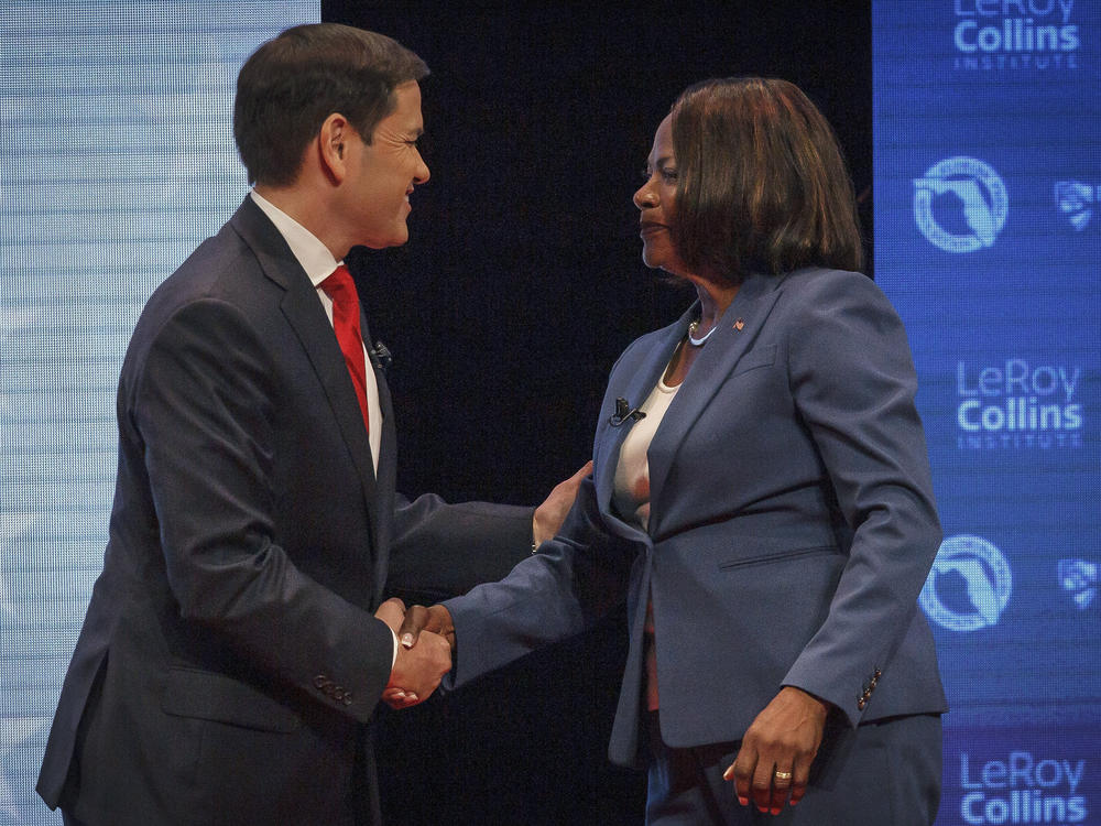 Republican U.S. Sen. Marco Rubio, and his Democratic challenger, U.S. Rep. Val Demings, greet each other before a televised debate at Duncan Theater on the campus of Palm Beach State College on Tuesday.