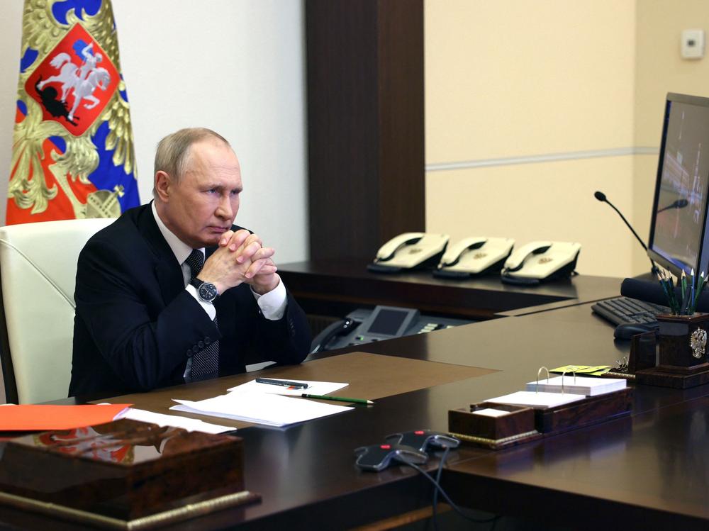 Russian President Vladimir Putin chairs a Security Council meeting via a video link at the Novo-Ogaryovo state residence outside Moscow on Wednesday. Putin introduced martial law in Ukraine's Donetsk, Luhansk, Kherson and Zaporizhzhia regions that Moscow claims to have annexed.