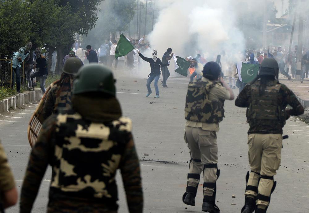 Indian government forces clash with Kashmiri protesters after Eid prayers in Srinagar on June 26, 2017. The region has seen decades of violence since an armed insurgency began fighting India's rule.