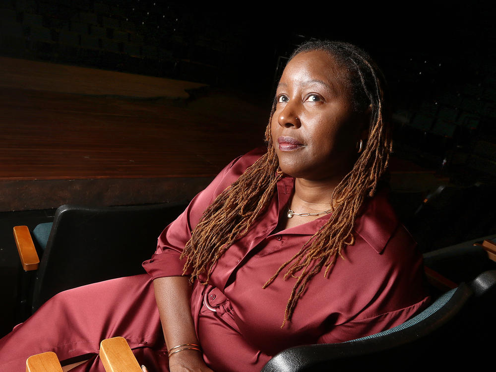 Oregon Shakespeare Festival Artistic Director Nataki Garrett sits inside the Thomas Theatre in Ashland, Ore.