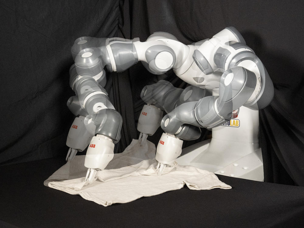 Most robots have not generally been equipped for the task of folding clothes. But an international group of researchers say their new method could change that — or at least speed up the process. Their robot is seen here in multiple exposures.