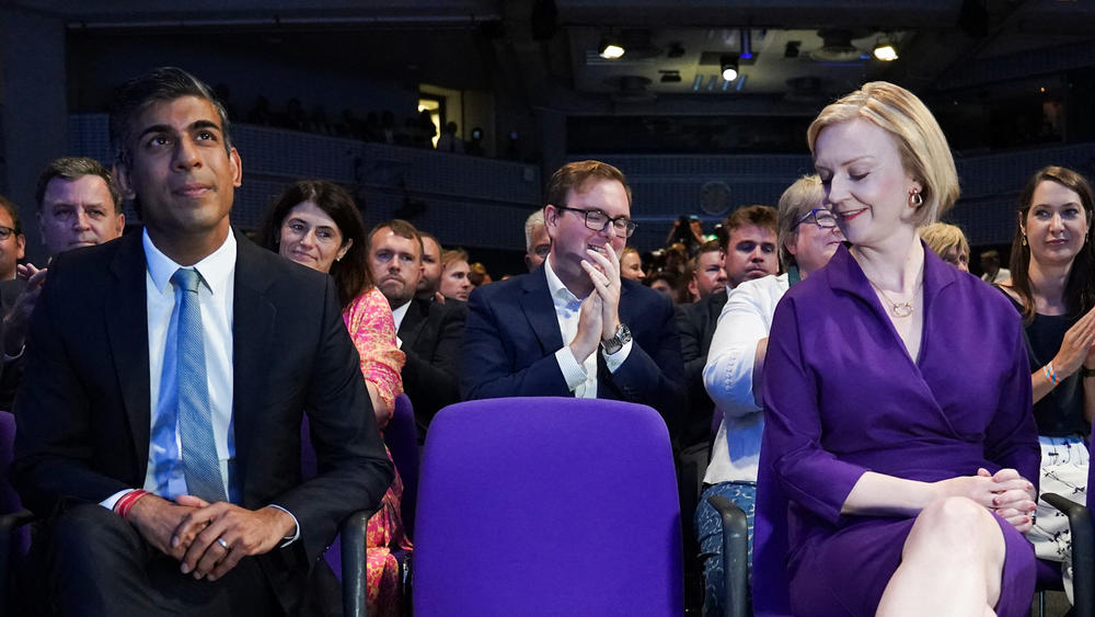 Former Chancellor of the Exchequer Rishi Sunak sits with Liz Truss during the announcement of the winner of the Conservative Party leadership contest in September. Sunak is considered more of a centrist and pragmatic politician than Truss.