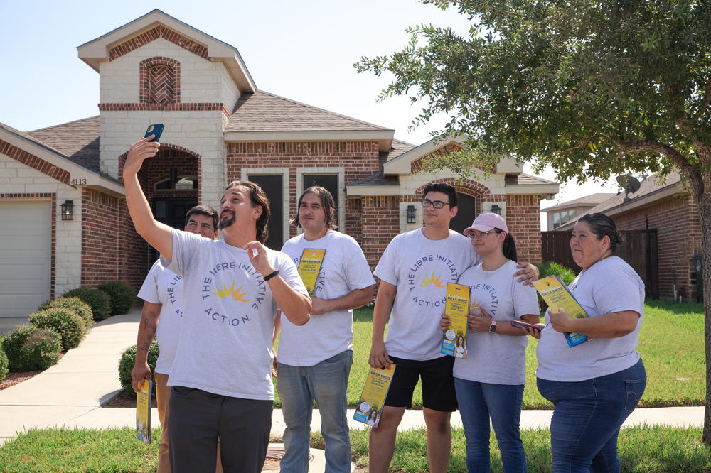 Members of LIBRE canvassing Oct. 5 in a neighborhood in Mission, Texas, pose for a selfie.