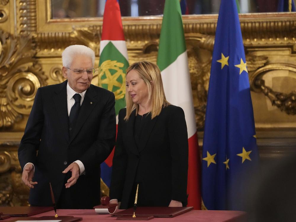 Italian President Sergio Mattarella is flanked by newly appointed Italian Premier Giorgia Meloni during the swearing in ceremony in Rome on Saturday.