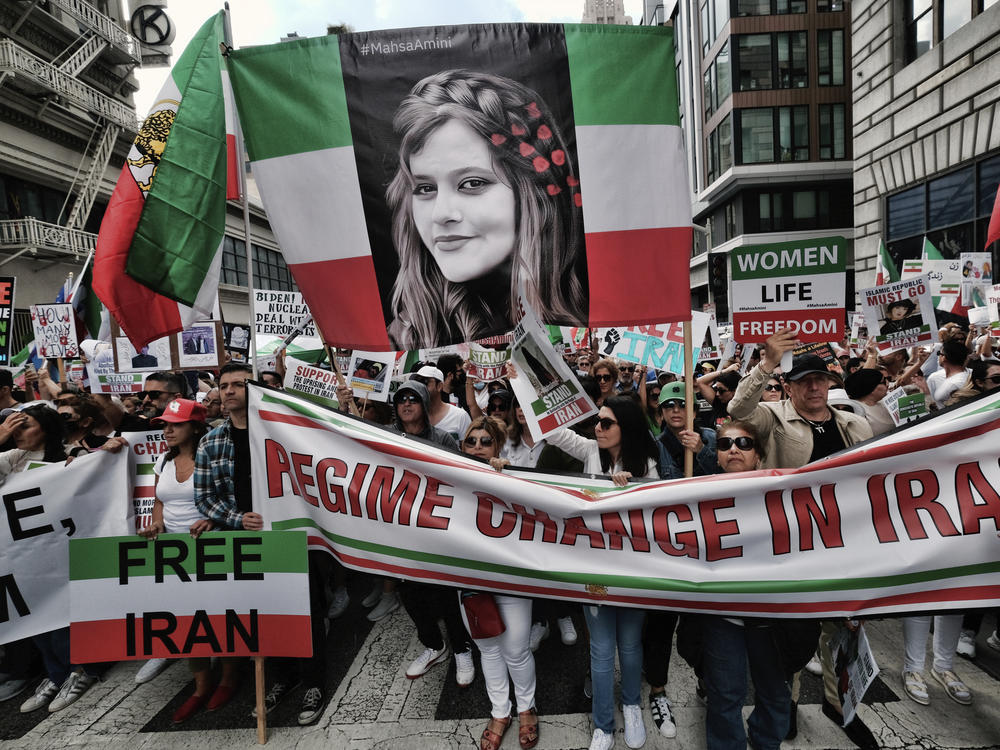 Demonstrators carry a large photo of Mahsa Amini during a protest against the Iranian regime, in Los Angeles, on Saturday.