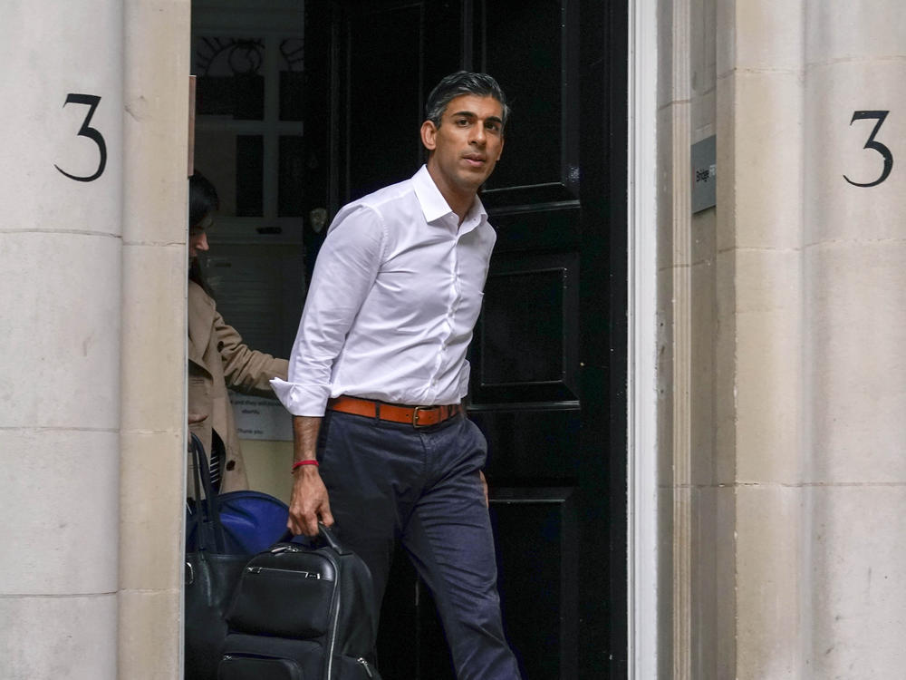 Conservative Party leadership candidate Rishi Sunak leaves his campaign office in London on Sunday. Sunak is frontrunner in the Conservative Party's race to replace Liz Truss as prime minister.