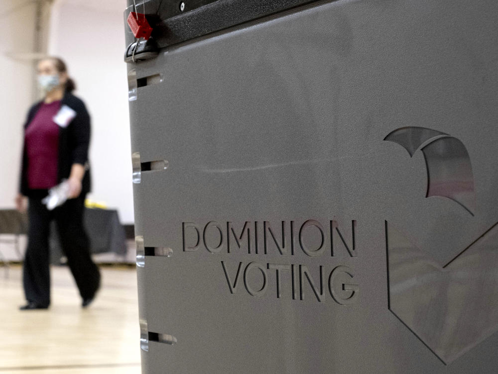 A Dominion Voting Systems ballot scanner is seen in this 2021 file photo. Election deniers have spread conspiracies about the Denver-based company's voting machines.