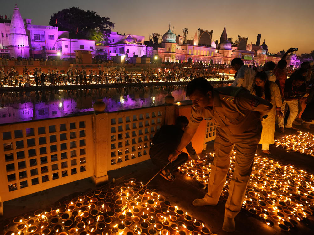 People light lamps on the banks of the river Saryu in Ayodhya, India, Sunday, Oct. 23, 2022.