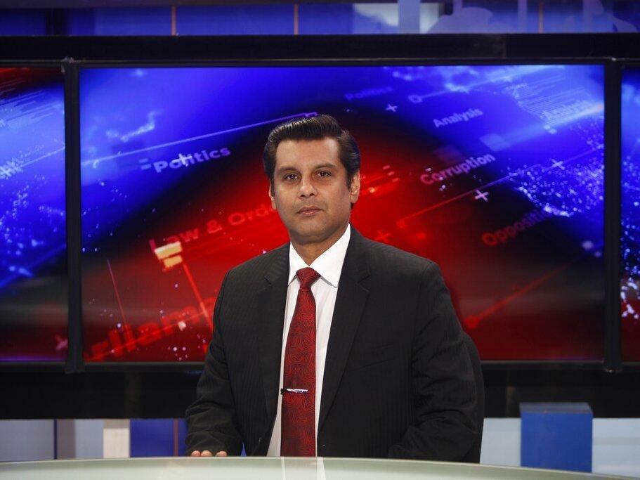 Senior Pakistani journalist Arshad Sharif poses in December 2016 for photograph prior to recoding an episode of his talk show at a studio in Islamabad.