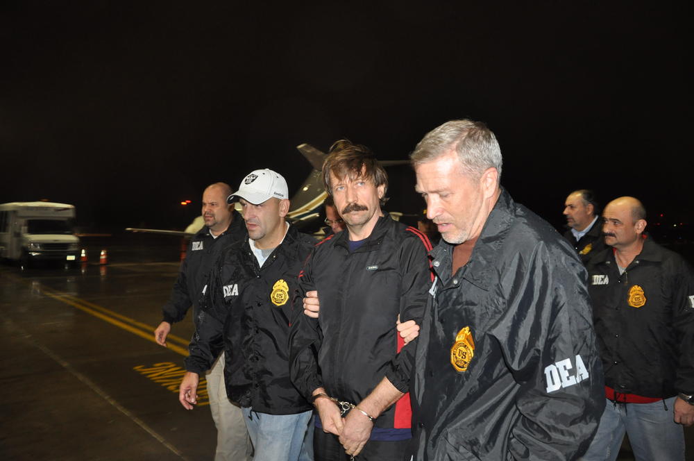 In this photo provided by the U.S. Department of Justice, Russian arms trafficking suspect Viktor Bout deplanes after arriving at Westchester County Airport in New York on Nov. 16, 2010. Bout was extradited from Thailand to the U.S. to face terrorism charges.