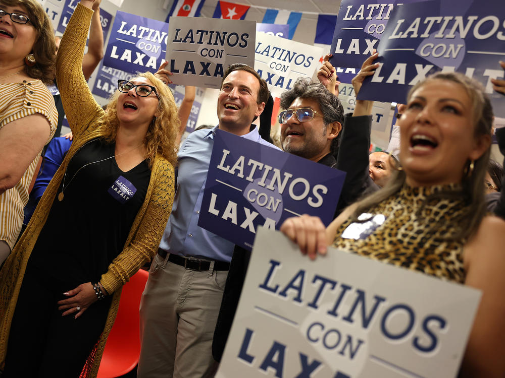 Nevada Republican U.S. Senate candidate Adam Laxalt (center) takes a group photo with supporters during a Hispanic Heritage Month Fiesta at the RNC Hispanic Community Center on Oct. 13, in Las Vegas. Republicans are making inroads to appeal to Latino voters.