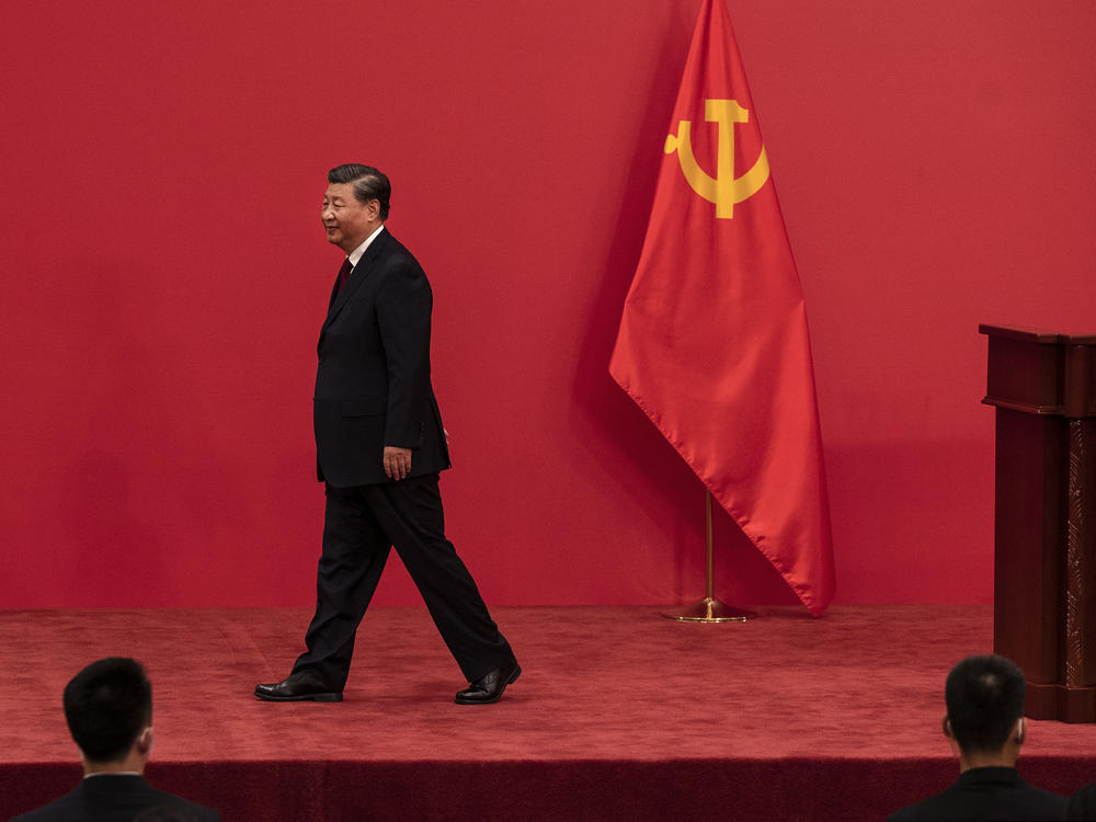 Chinese leader Xi Jinping leaves a press event with national and foreign journalists about the new Standing Committee of the Communist Party of China at The Great Hall of People in Beijing on Sunday.