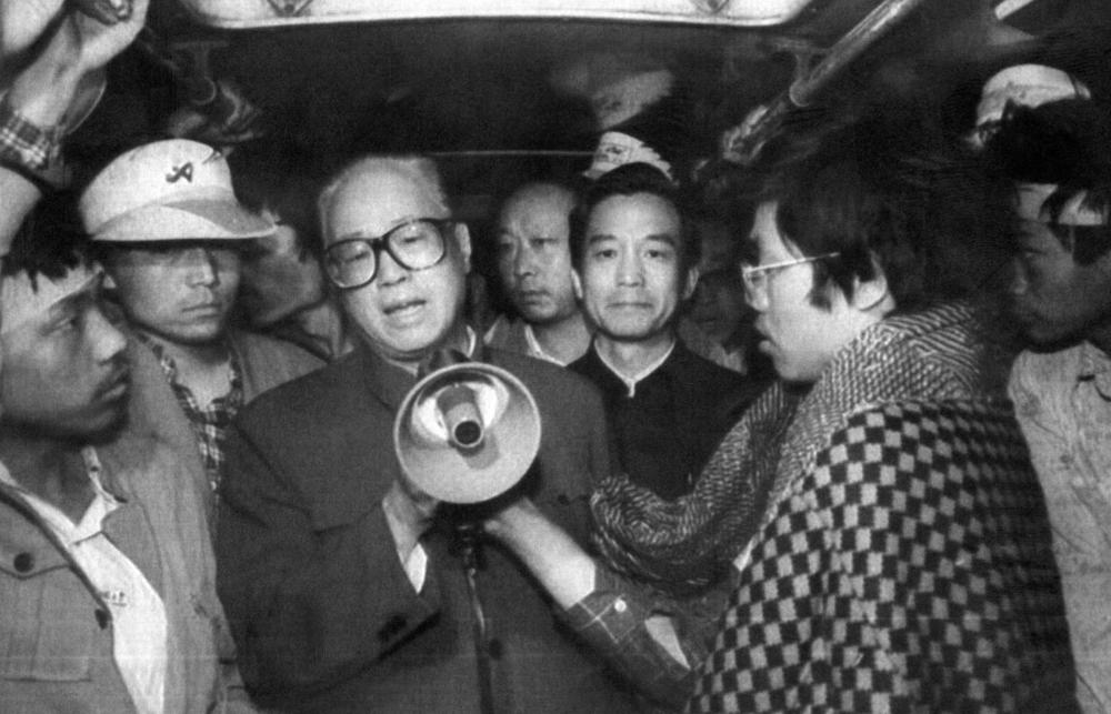 Chinese Communist Party Secretary General Zhao Ziyang (center) addresses student hunger strikers on a bus at Tiananmen Square in Beijing, where pro-democracy hunger strikers had been sheltered, on May 19, 1989.