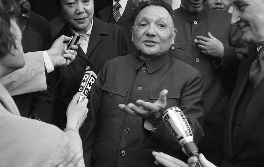 Deng Xiaoping speaks with journalists during a visit to France in May 1975.