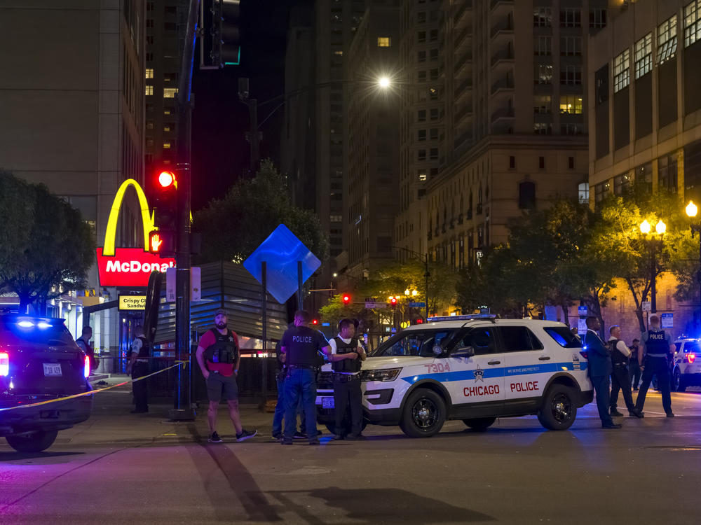 Chicago police officers arrive at the scene of a May 19 mass shooting outside a McDonald's restaurant.