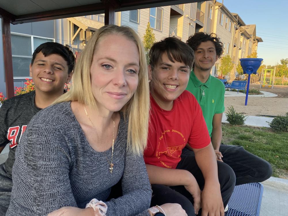 GlendaRika Garcia, a mother in Westminster, Colo., with her sons, Pedro, Alonzo and Mauricio. Garcia, a bilingual food assistance aid for Hunger Free Colorado, backs the ballot measure. She said if it passes it would ease some financial pressure on families who struggle with food insecurity but don't qualify for free school meals.
