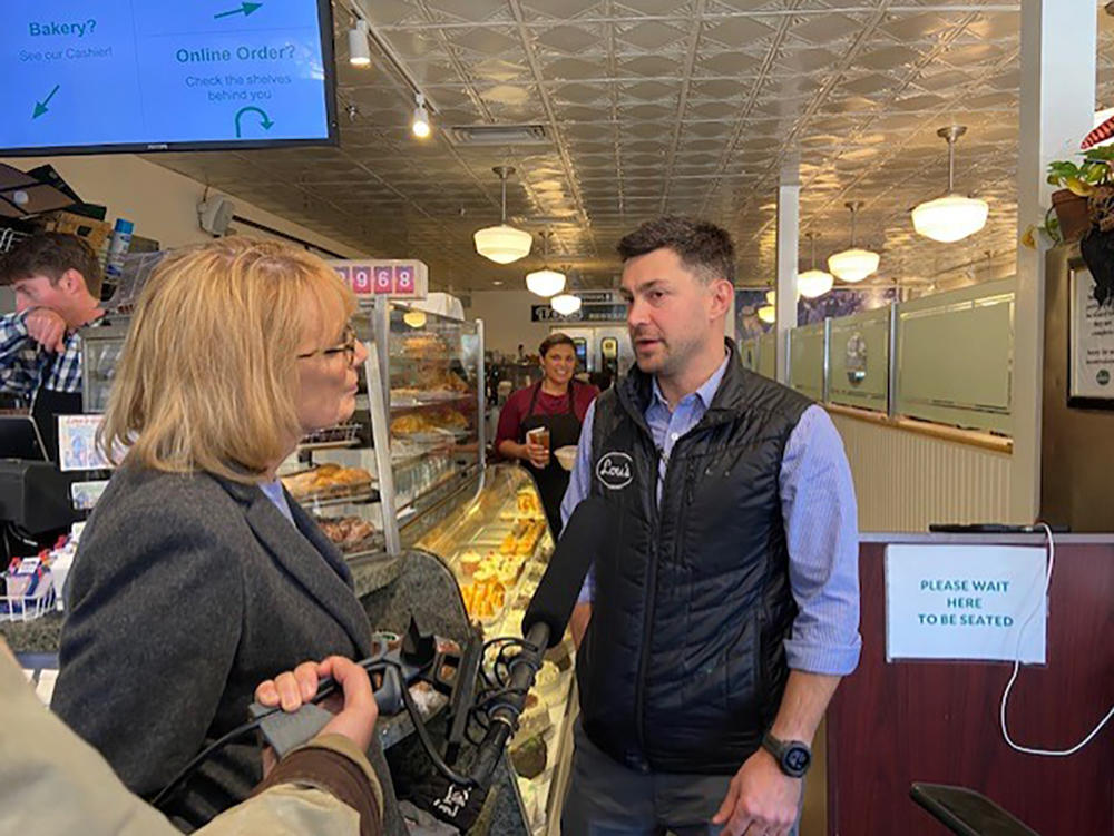 Democratic Sen. Maggie Hassan spoke to Jarrett Berke, owner of Lou's Restaurant in Hanover, N.H.