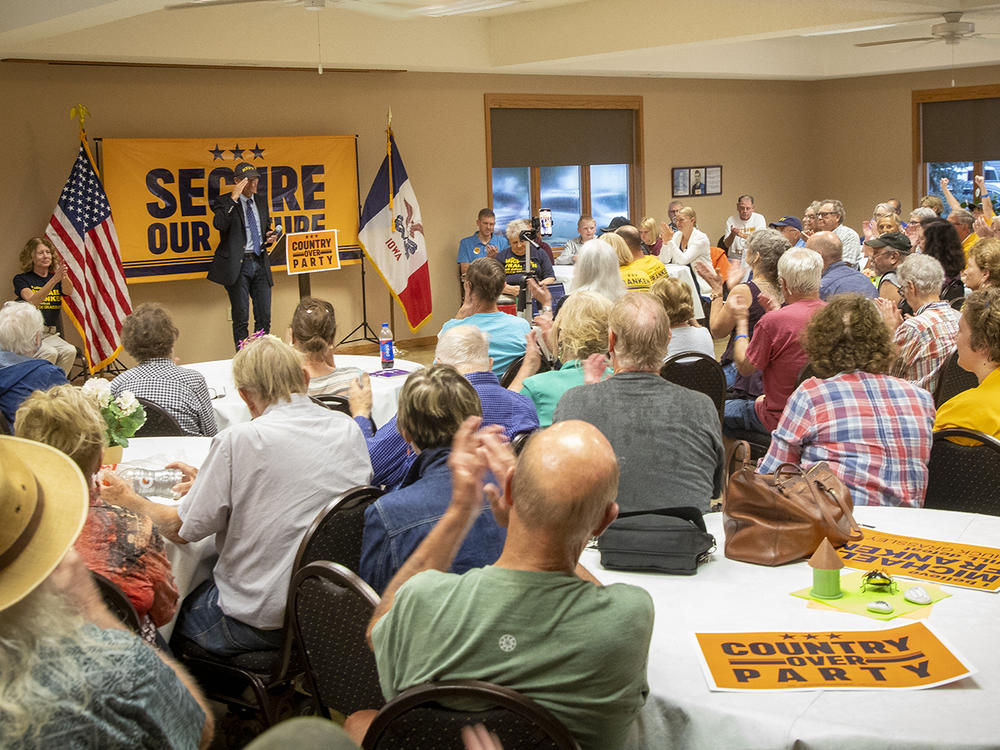 Democratic U.S. Senate candidate Mike Franken speaks to a crowd of supporters at the United Methodist Church in his Republican opponent Sen. Chuck Grassley's hometown of New Hartford, Iowa, on Aug. 27.
