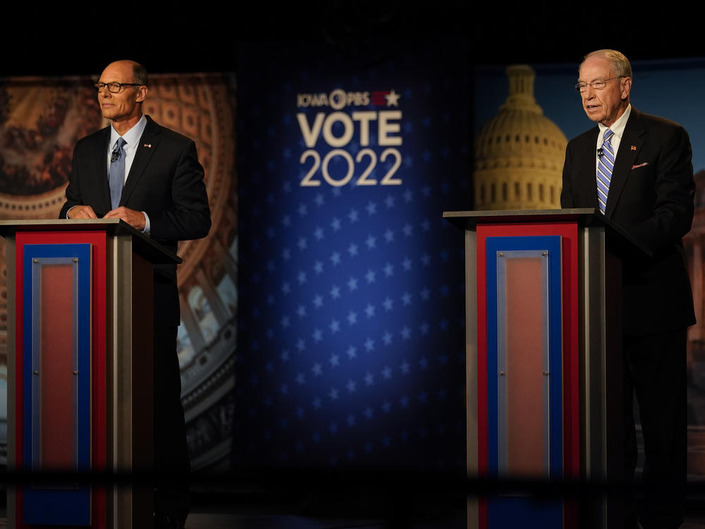 Iowa Democratic U.S. Senate candidate Mike Franken, left, and Sen. Chuck Grassley, R-Iowa, stand on stage before a debate Oct. 6 in Des Moines.