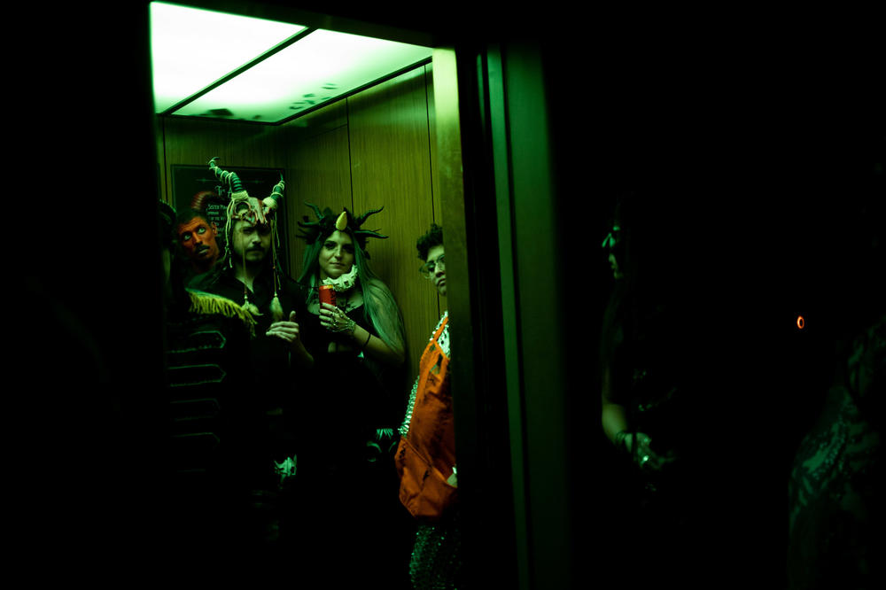 People pack into an elevator as they head up to explore all 8 floors of the Theatre Bizarre.