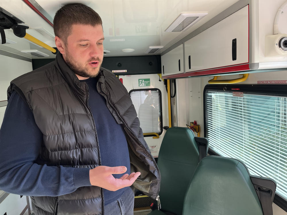Dr. Yevgeniy Sinko inside his hospital's ambulance in Kupiansk on Oct. 18. He says he was held hostage for over two months by Russian soldiers.