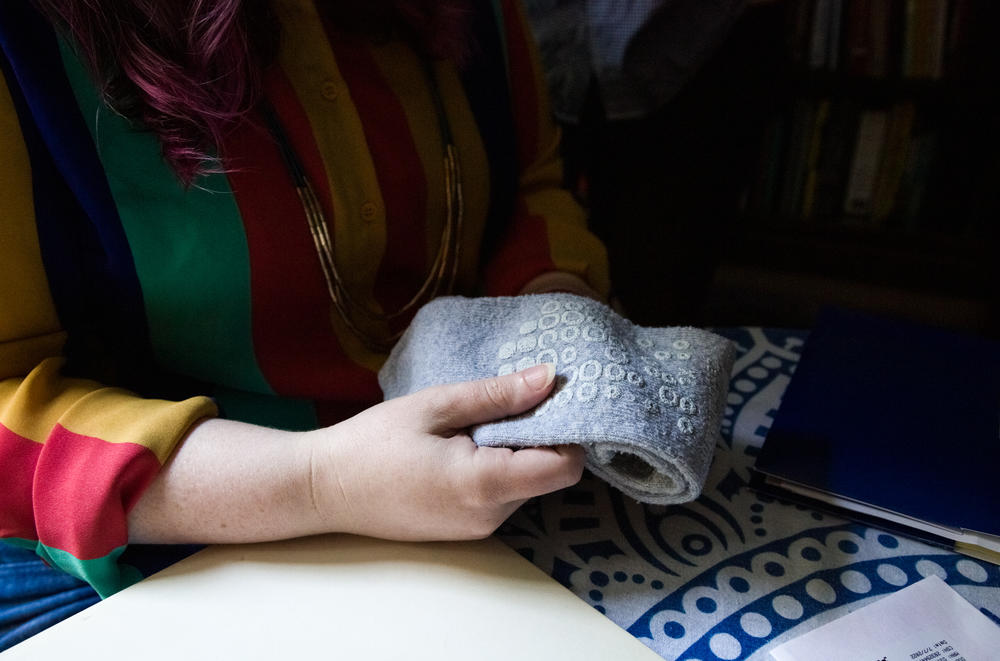 Karla kept a pair of hospital socks that her all-female care team had put on her following the abortion. To her, the socks symbolized the care that the team had given her throughout the procedure.