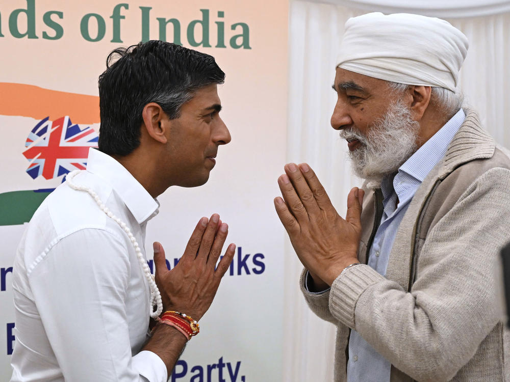 Rishi Sunak meets members of the audience after delivering a speech during a Conservative Friends of India event at the Dhamecha lohana center in August in Harrow, England.